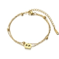 Double-layered golden stainless steel chain bracelet featuring a letter B pendant - Letter B