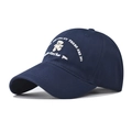 Macro detail of the premium navy blue cotton fabric and white bear embroidery on baseball cap - Navy Blue Cartoon Bear