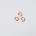Three orange painted metal open jump rings for DIY jewelry making on white background - Light Orange