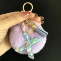 Porte-clés pompon violet avec lettre X en résine et paillettes en forme de cœur - Lettre X