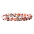 Detailed macro view of pink marbled stone beads and engraved silver metal spacer bead - Red Network Stone