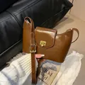 Brown glossy leather shoulder bag with vintage gold square lock and adjustable strap - Brown