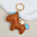 Brown leather horse keychain with light blue accents and a golden money bag charm - Large / Brown