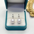Detail of high-luster freshwater pearl earrings with silver hooks in a jewelry box - 11mm Silver Base Round Pearl Silver High Heel