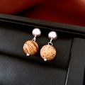 Detailed close-up of 18K gold plated horse pearl stud earrings with brown stone beads - Silver Stone Pattern Round Bead Earrings