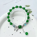 Elegant green beaded bracelet with a silver butterfly pendant and sparkling gemstone charm - S014-grass Green Butterfly Imitation Cat's Eye Stone Bracelet #sz266