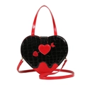 Elegante bolso corazón negro de cocodrilo con detalle de flecha roja y herrajes dorados - Negro