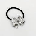 Elastic black hair tie featuring a large polished silver alloy butterfly pendant decoration - Rounded Silver