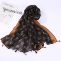Detail of printed linen shawl with tassels in deep brown and yellow tones - Style 17