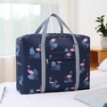 Navy blue travel bag with pink flamingo print and sturdy gray woven straps - Navy Flamingo