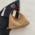 Retro woven straw hobo bag with brown PU leather straps in a bright lifestyle setting - Brown