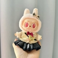 Labubu doll in beige cardigan and black pleated skirt with gold heart bag accessory - Blue-gray Plaid Jk Crossbody Bag Five-piece Set / First And Second Generation Keychains Are Compatible With La Cloth Dolls. Dolls Not Included.