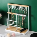 White minimalist iron jewelry stand with wooden base for organizing necklaces and earrings - New Jewelry Rack / White