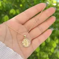 Detailed view of an 18K gold-plated Virgin Mary octagonal pendant with white zircon stones - Style 6-Octagonal Border