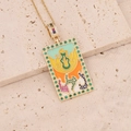 Macro shot of 18K gold tarot necklace featuring colorful enamel and green micro zircons - Yellow Orange Flame Style (8#)