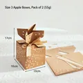 Brown kraft paper Christmas gift box with gold stars and cream ribbon bow detail - Apple Box Style 3