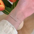 Minimalist double-layered silver bracelet with small beads worn on a wrist - Silver Double Layer Layering Round Bead (MY32768)