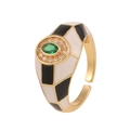 Detail of 18K gold plated ring featuring black and white enamel with a green zircon - Adjustable Open / Black & White