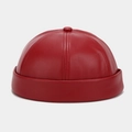 Detailed close-up of dark red PU leather docker hat with minimalist 6-panel stitching - Adjustable / Red