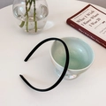 Minimalist slim black headband with a smooth finish in a stylish home decor setting - Black Headband