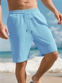 Close-up of light blue pleated texture and drawstring waist on men's beach shorts - Light Blue
