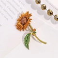 Exquisite sunflower brooch in golden and green alloy with intricate micro-carved petal details - Sunflower Style