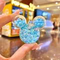 Macro shot of Mickey head liquid quicksand keychain with stars and blue spheres - Luminous Bubble Bead Mickey Head / 1 Piece (Without Keychain) / Blue