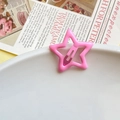 Chic pink star-shaped BB hair clip with a glossy finish on a white decorative plate - Pink