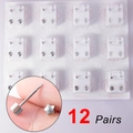 Detail showing 12 pairs of silver star and round stainless steel piercing ear studs - Silver Star Shape (12 Pairs)