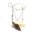 Tiger eye gemstone hexagonal pendulum pendant with silver chain on smile stand - Tiger Eye Stone Bracelet