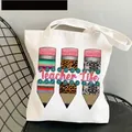 White canvas tote bag featuring Teacher Life print and colorful pencil graphics - Style C17