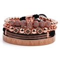 Details des Roségold-Schmucksets mit Kronenanhänger und Armbändern mit römischen Ziffern - Roségold
