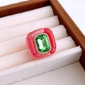 Detailed close-up of a vintage resin ring with emerald-cut green gemstone and pave crystals - Pink-Green