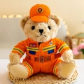 Adorable firefighter teddy bear plush toy in bright orange uniform sitting on mat - Firefighter Bear - Brown