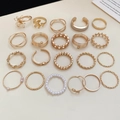 Flat lay of a 20-piece gold alloy ring set with diverse geometric and pearl designs - 22-Piece Set / Gold
