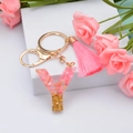 Letter Y resin keychain with pink tassel, gold glitter, and floral decor accents - Letter Y