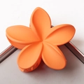 Matte orange plumeria hair claw clip in a large floral design for women hairstyles - Orange