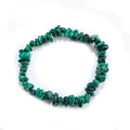 Macro shot of green malachite stone chips on an elastic bracelet with natural textures - Malachite
