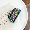 Bohemian acrylic hair claw clip with colorful tribal geometric patterns on a black base - Arrow Cyan Black