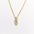 Detailed close-up of golden owl pendant featuring a clear zircon body and purple eyes - With Necklace / White