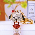 Cute golden puppy keychain with sparkling crystals and red lucky charm pendant - Wang Wang Lucky Dog Red