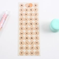 A-Z cream-colored alphabet sticker sheet with cute cartoon bear for DIY journals - Beige Uppercase