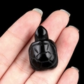Polished black obsidian turtle figurine hand-carved with geometric shell patterns - Obsidian