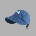 Detailed close-up of blue denim hat showing white bow embroidery and texture - Drawstring Wide Brim Sun Hat Style / Dark Blue