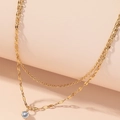 Dubbellaagse gouden titanium ketting met fonkelende zirkoon hanger en visgraatketting - Eenvoudig Dubbellaags met Zirkonia / Goud