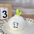 Cute plush garlic keychain accessory with sad facial expression on a decorative plate - Garlic (No Buckle)