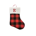 Detail of red and black buffalo plaid Christmas stocking with white faux fur cuff and letter E - Letter E