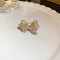 Anillo ajustable dorado con diseño de mariposa brillante y pequeños circonitas blancas - Anillo N.° 46: Lazo Dorado (galvanoplastia De Oro Real).