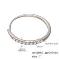 Macro detail of silver stainless steel ring with zircon inlays and 0.2cm band width - US 7 / Steel Color - White Zirconia