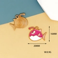 Detail view of pink anglerfish enamel charm with size 20x16mm and golden metal back - 5 Pink Clownfish